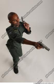 ERIC KNEELING POSE WITH GUNS